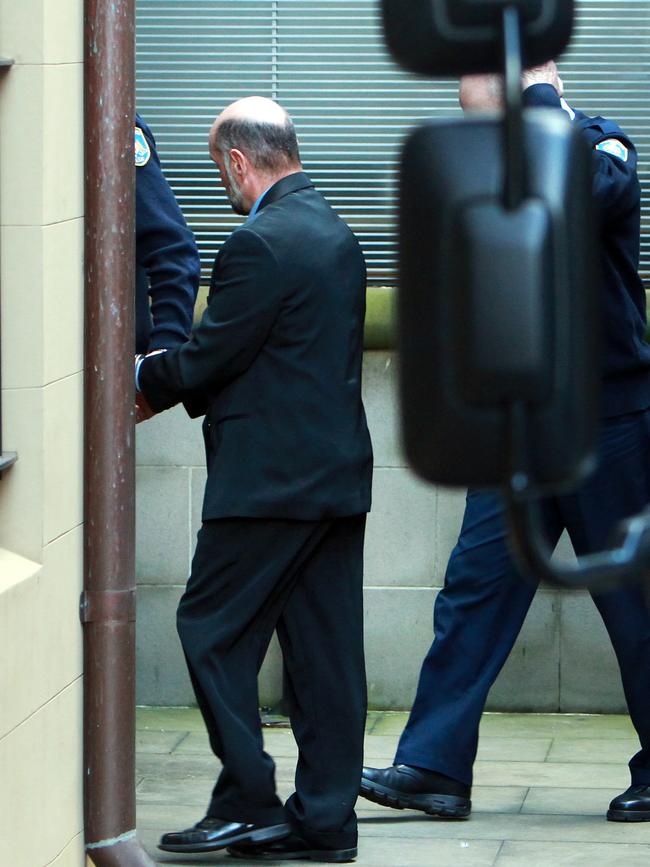 Kelly, then aged 54, pictured entering court in the custody of Corrective Services officers in 2012.