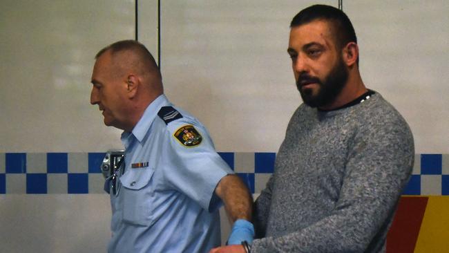 Ricardo Barbaro is escorted to a prison van at Burwood Court on Thursday. Picture: Joel Carrett/AAP