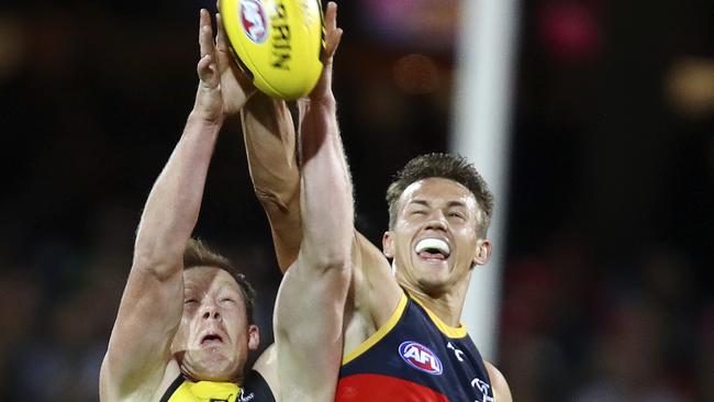 Tom Doedee attempts to spoil Richmond star Jack Riewoldt on Thursday night. Picture SARAH REED