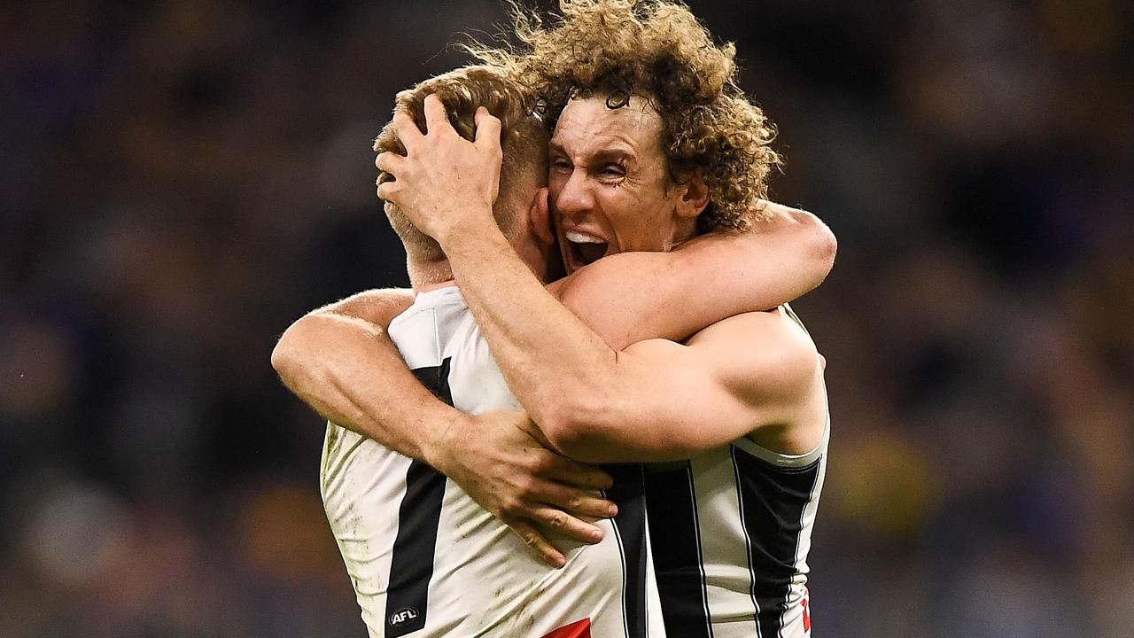 Chris Mayne celebrates a Collingwood win with teammate Adam Treloar. Picture: Getty Images