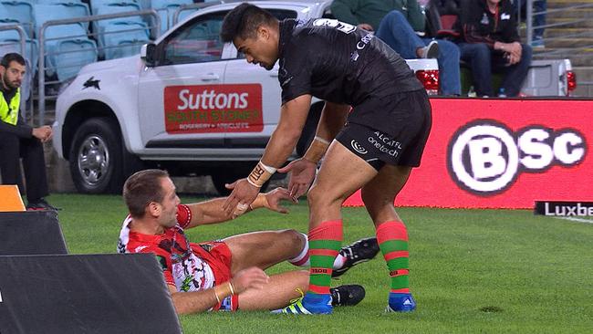 Kirisome Auva’a helps Jason Nightingale to his feet.