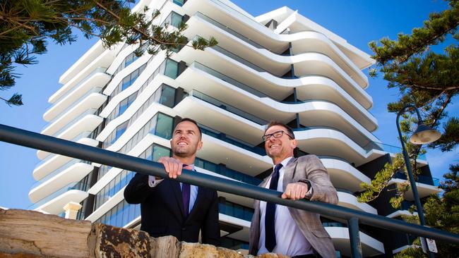 Medallion Homes chief executive Jordan Katelanis and Chasecrown founder and project director Louis Kanellos in front of the $83 million 8 South Esplanade apartments project.