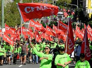 MAY DAY: Queensland union members march at the Labour Day Parade in Brisbane on Monday. Picture: DAVE HUNT