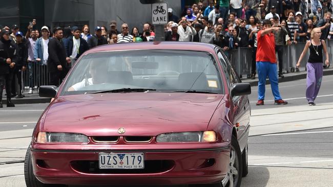 Armed police were forced to hang back as the car did circles at one of Melbourne’s busiest intersections. Picture: Tony Gough