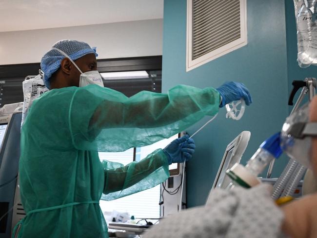 A nurse tends to a Covid-19 patient at the intensive care unit of the Delafontaine AP-HP hospital in Saint-Denis, outside Paris. Picture: AFP