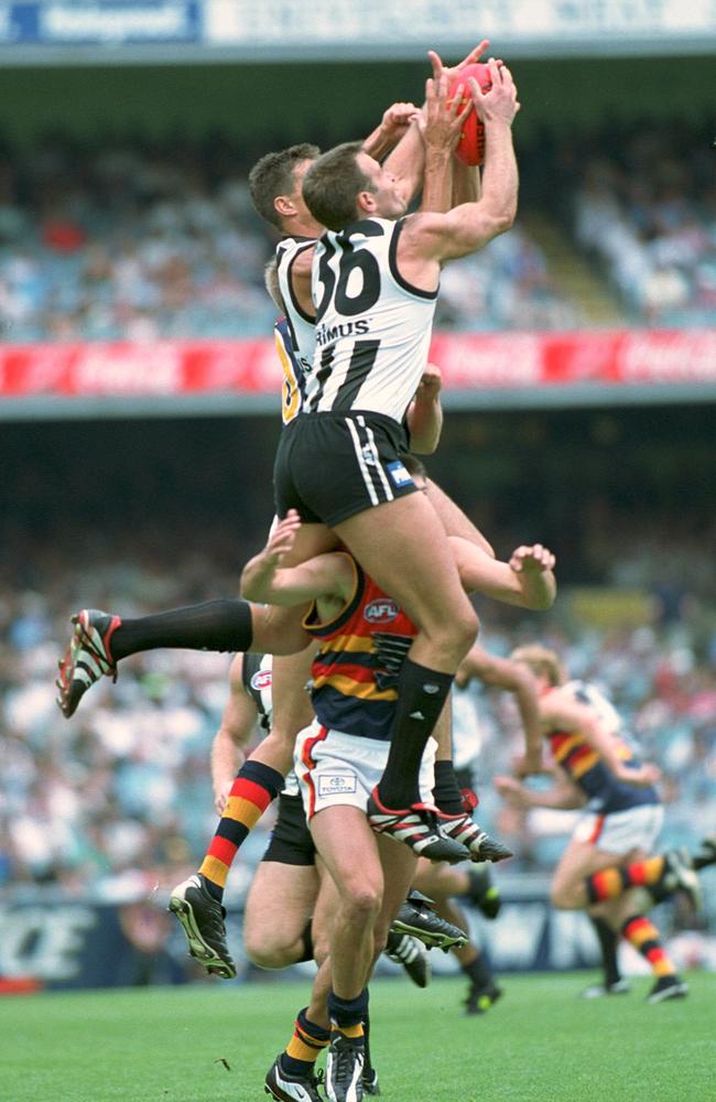 Rocca pulls down a hanger at the MCG in the ‘90s.