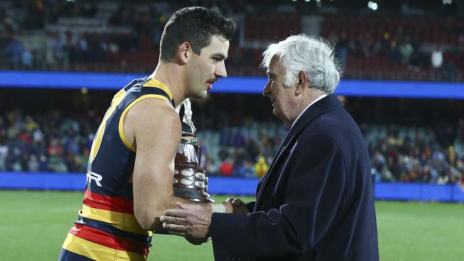 Hammond presenting Taylor Walker with the Showdown 43 trophy. Picture: Sarah Reed