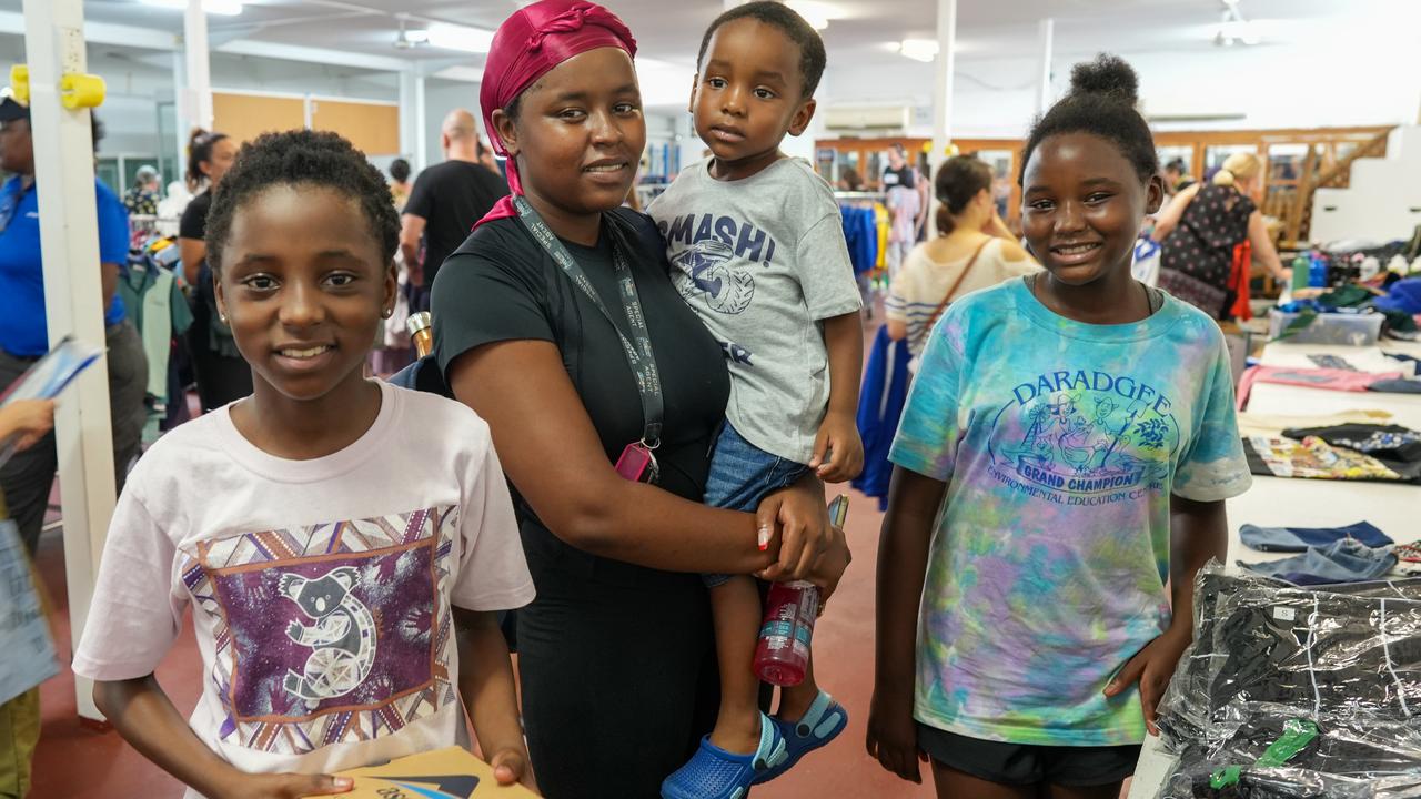 Elizabeth, Deborah, Robert and Christine Assumani collecting school supplies. Picture: Nuno Avendano