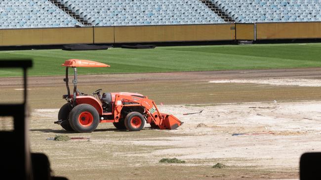 Parts of the MCG turf will be replaced ahead of the AFL round 1. Tractors and workmen busy ripping up and replacing the MCG turf. Picture: David Caird