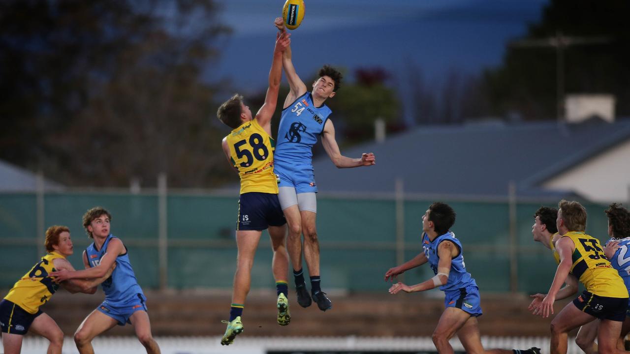 Sturt’s Blake Thredgold and Woodville-West Torrens’ Logan Hughes contest the ruck in a SANFL under-16s game at Woodville Oval. Picture: Dean Martin