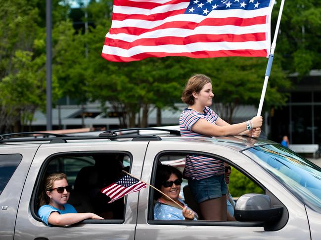 COLUMBIA, SC - APRIL 24: People protest from their vehicle against government closures of non-essential businesses due to the coronavirus on April 24, 2020 in Columbia, South Carolina. Although the state has allowed some non-essential businesses to re-open, restaurants, barber shops, massage therapists, entertainment venues and others remained closed by state order. (Photo by Sean Rayford/Getty Images)