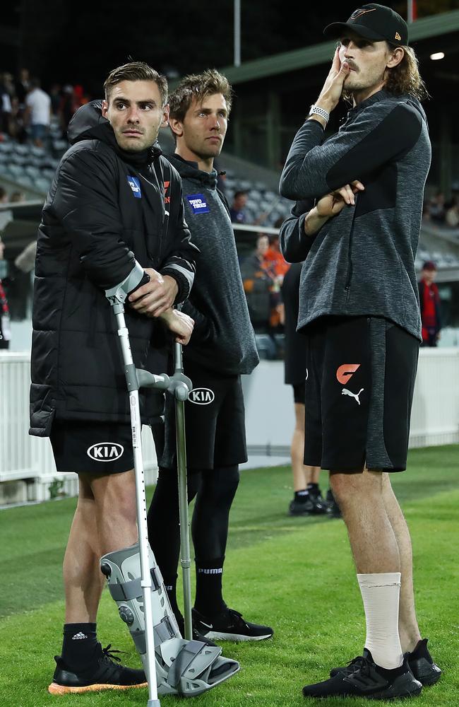 Stephen Coniglio finished in a moon boot, while Phil Davis and Matt de Boer were also ruled out during the match. Picture: AFL Photos/Getty Images