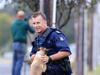 Cop allegedly drags police officer beside car