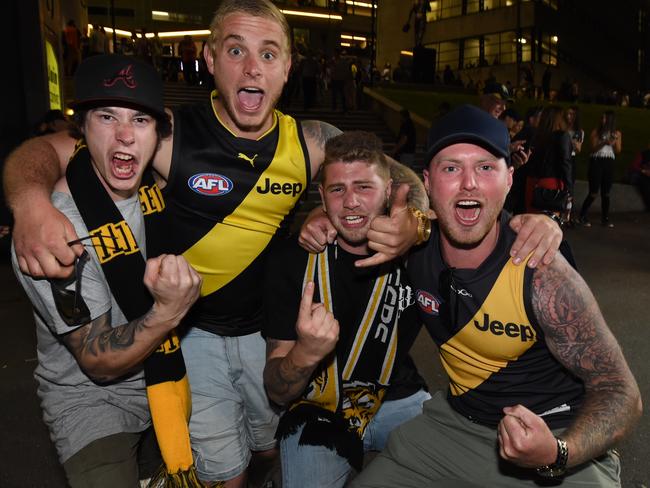 Richmond fans leaving the MCG after winning the semi-final. Picture: Tony Gough