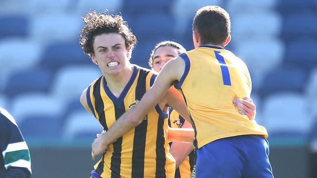 St Bernard's wins the Herald Sun Shield grand final against St Patrick's. AFL players Lachlan Sholl and Jake Riccardi (Captain) celebrate a goal. picture: Glenn Ferguson