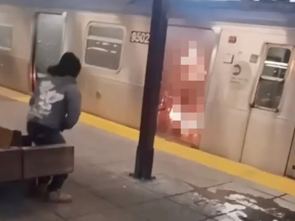 Horrifying video shows the woman burning as the man watches on. Picture: NY Post