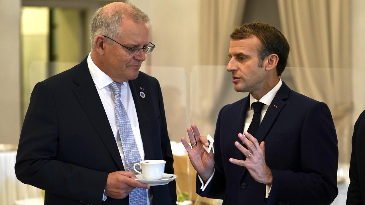 Australian Prime Minister Scott Morrison and French President Emmanuel Macron talk.