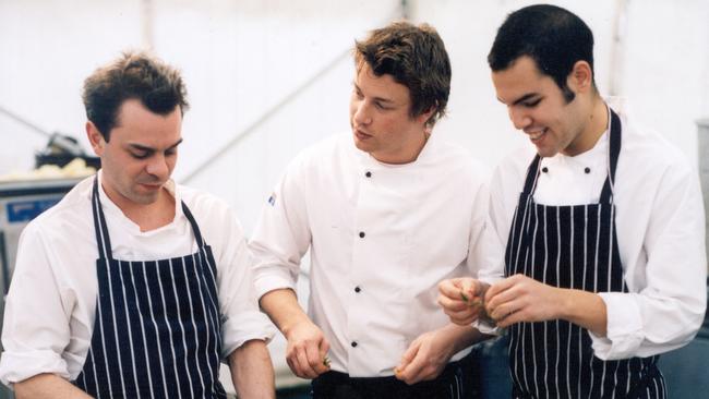 Chef Jamie Oliver with trainee Tim Siadatan (right) and the executive chef at Fifteen restaurant in London, Eamon Fullalove in 2003.