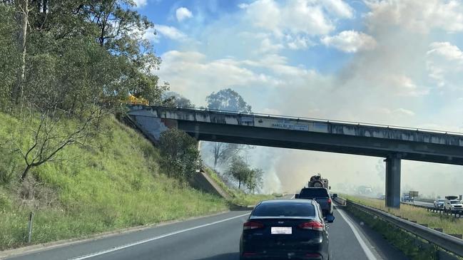 Smoke warning issued for areas around Blackwater near Ipswich as fire can be seen next to the Cunningham Highway. Photo: Ipswich Metal Recycling