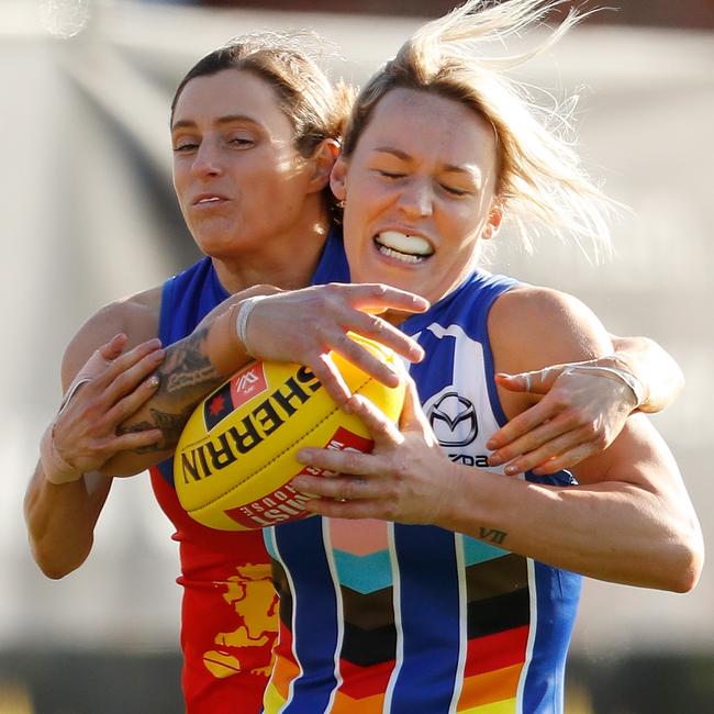 Sarah Wright of the Kangaroos is tackled by Ruby Svarc.