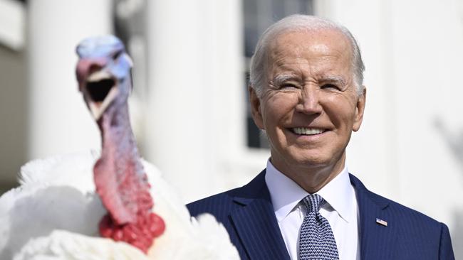 US President Joe Biden pardons the national Thanksgiving turkey, Liberty, during a pardoning ceremony at the White House.