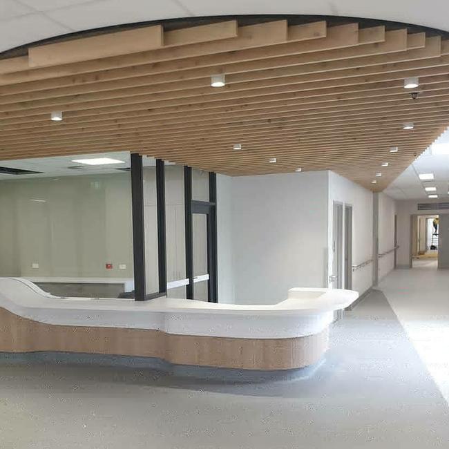 The beautiful timber feature in the new emergency department's reception area is made from timber preserved and milled from the pine trees that were removed from the site to make way for the facility.