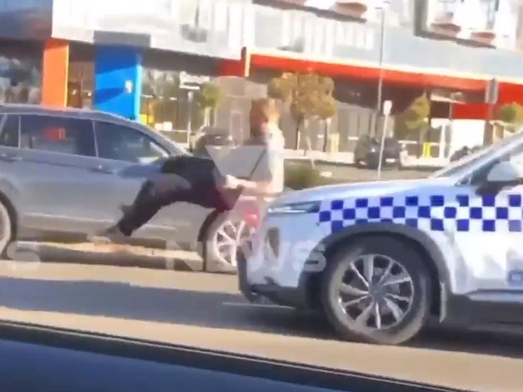 A second video showed Mr Atkins being hit by a police car just moments before the shocking arrest unfolded. Picture: 7News