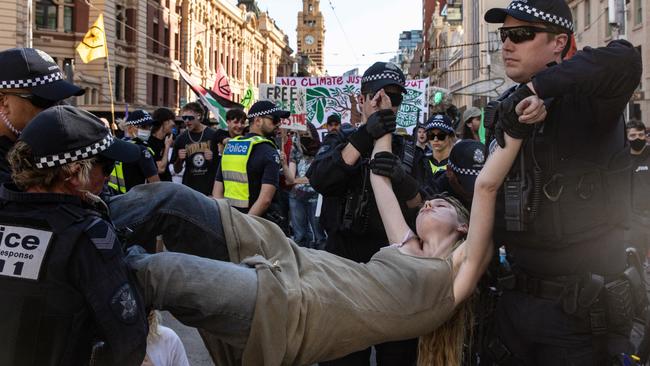 Police remove a protester. Picture: NCA NewsWire / Diego Fedele