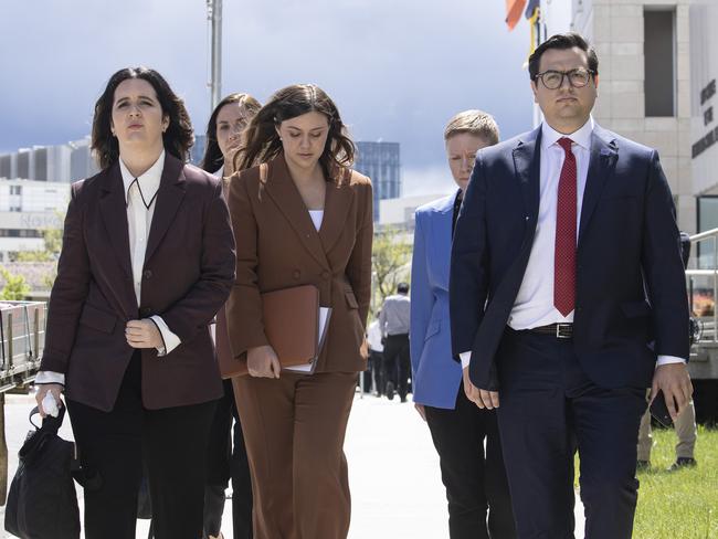 Brittany Higgins with her partner David Sharaz left the Magistrates Court in Canberra. Former Labor advisor and friend of Sharaz, Emma Webster, is pictured at left.