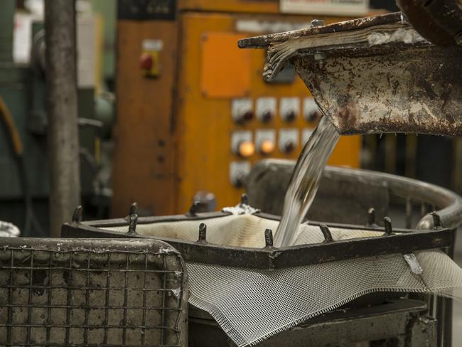 Molten aluminium is poured through a sieve at the Nissan Australia Casting Plant. <i>Picture: Supplied</i>