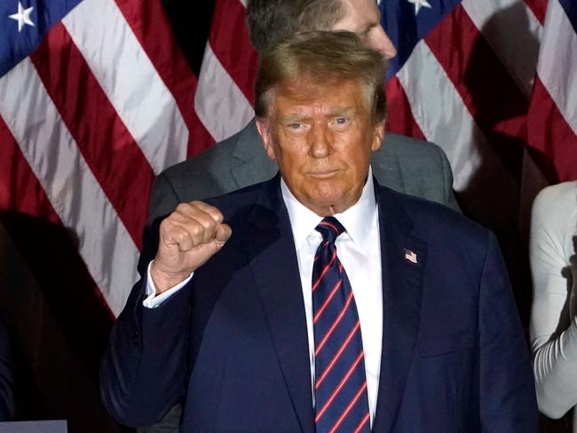 Republican presidential hopeful and former US President Donald Trump gestures during an Election Night Party in Nashua, New Hampshire, on January 23, 2024. Donald Trump won the key New Hampshire primary Tuesday, moving him ever closer to locking in the Republican presidential nomination and securing an extraordinary White House rematch with Joe Biden. (Photo by TIMOTHY A. CLARY / AFP)