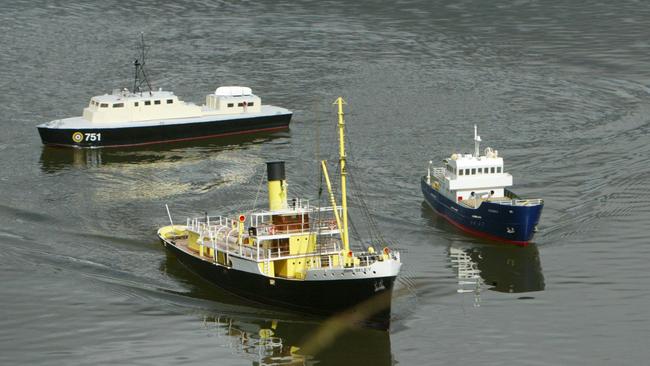 Bob Churchill, of Saratoga on the Central Coast of NSW, who has built a replica of the original heritage boat John Oxley (C), at the Mt (Mount) Penang Parklands Dam.