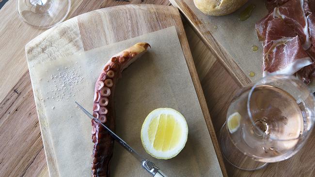 The smoked octopus at South Press, served simply with lemon, jamon and bread.