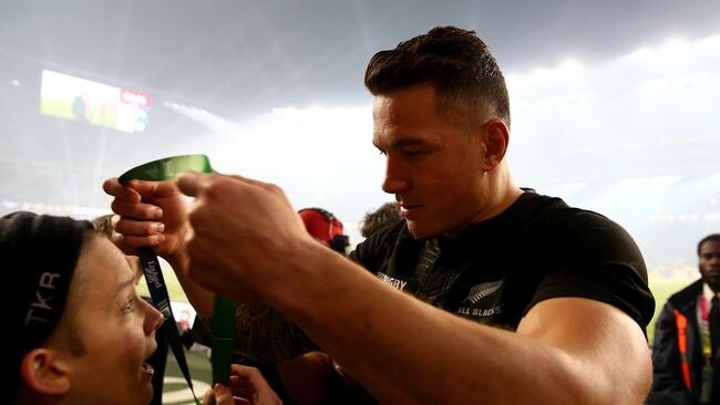 Sonny Bill Williams gives his medal to a young boy after the 2015 Rugby World Cup.