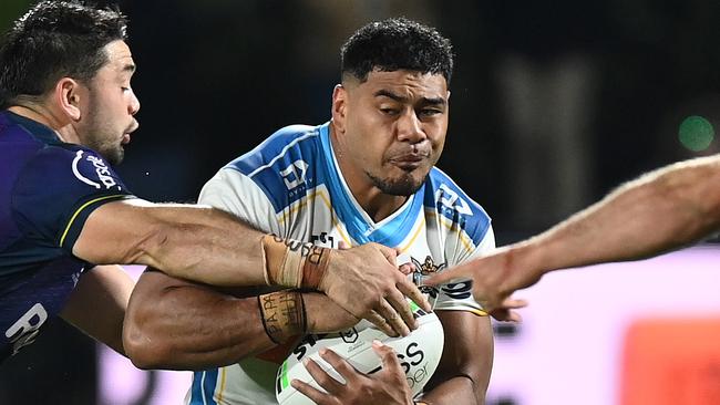 SUNSHINE COAST, AUSTRALIA - JUNE 05: Greg Marzhew of the Titans is tackled during the round 13 NRL match between the Melbourne Storm and the Gold Coast Titans at Sunshine Coast Stadium, on June 05, 2021, in Sunshine Coast, Australia. (Photo by Bradley Kanaris/Getty Images)