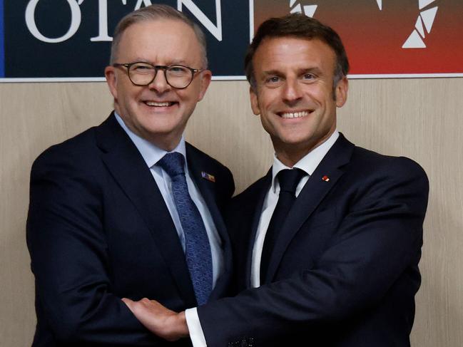 Prime Minister Anthony Albanese (left) shakes hands with French President Emmanuel Macron on the sidelines of the NATO summit in Vilnius. Picture: Ludovic Marin/AFP