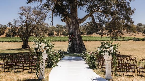 A long white “carpet” snaked to a tree as the bridal entrance. Picture: Supplied