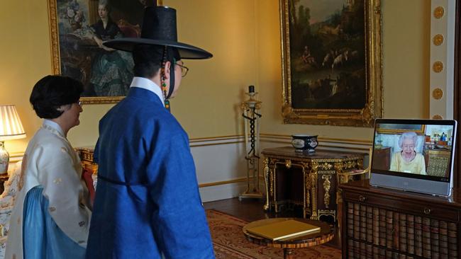 Britain's Queen Elizabeth II appears on a screen via videolink. Picture: Victoria Jones / AFP