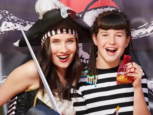 Alex Pratt as Penelope Pirate and Cassidy, nine, look for clues at Harbour Town's treasure hunt. Picture: Matt Loxton