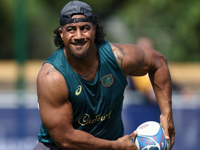 Pone Fa'amausili passes during a Wallabies training session. Picture: Chris Hyde/Getty Images