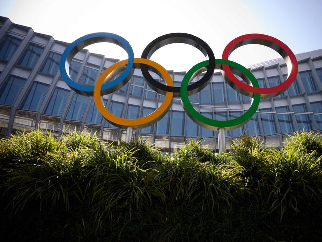The Olympic Rings logo is pictured in front of the headquarters of the International Olympic Committee (IOC) in Lausanne on March 18, 2020, as doubts increase over whether Tokyo can safely host the summer Games amid the spread of the COVID-19. - Olympic chiefs acknowledged on March 18, 2020 there was no 