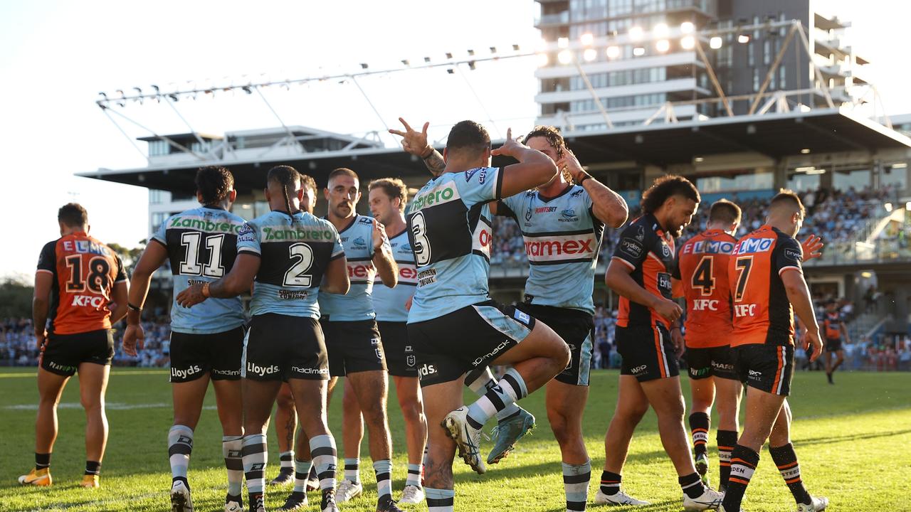 SYDNEY, AUSTRALIA - APRIL 10: Jesse Ramien of the Sharks celebrates with Nicholas Hynes of the Sharks after Sione Katoa scoring a try during the round five NRL match between the Cronulla Sharks and the Wests Tigers at PointsBet Stadium, on April 10, 2022, in Sydney, Australia. (Photo by Mark Kolbe/Getty Images)