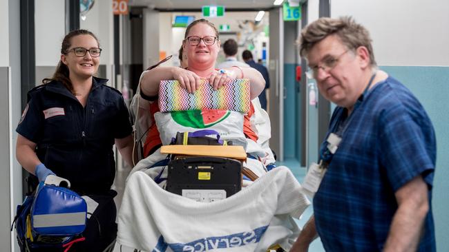 Susan Qualtrough is transported to the maternity ward. Picture: Jake Nowakowski