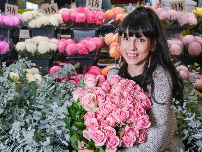 Tafe floristry student Melissa Guineay amongst blooms at Central Market Flowers, Wednesday, May 8, 2019. TAFE SA running a floral workshop for mother's day at Adelaide Central Market. (Pic: Brenton Edwards)