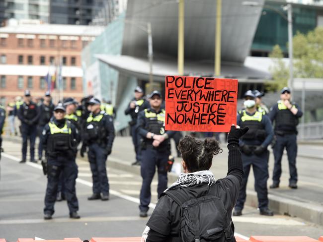 Protesters gathered on Spencer St bridge to demonstrate against the Land Forces Expo. Picture: Andrew Henshaw