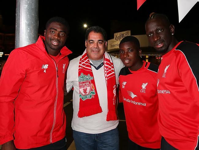 BRISBANE, AUSTRALIA - JULY 16: Queensland Rugby League legend and Liverpool FC fan Mal Meninga with Liverpool FC players (L-R) Kolo Toure, Sheyi Ojo and Mamadou Sakho at the renaming of Caxton st as Anfield Road to celebrate the arrival of Liverpool FC on July 16, 2015 in Brisbane, Australia. Liverpool FC are in Queensland to play the Brisbane Roar at Suncorp Stadium on the first leg of their Australian tour (Photo by Chris Hyde/Getty Images for Tourism Queensland)