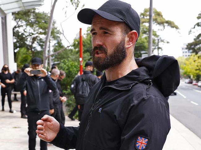 WEEKEND TELEGRAPH - 26.1.24UNTIL MUST NOT PUBLISH  BEFORE CLEARING WITH PIC EDITOR  - Members from the Neo Nazi group NSN are moved on by police at North Sydney after they tried to go to the city to protest. Leader of the group Thomas Sewell pictured.  Picture: Sam Ruttyn