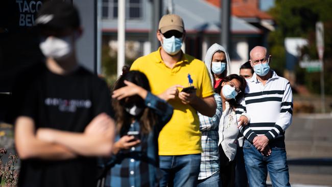 People line up for a Covid-19 test at Annerley on Qld’s first full day of lockdown. Picture: NCA Newswire / Dan Peled