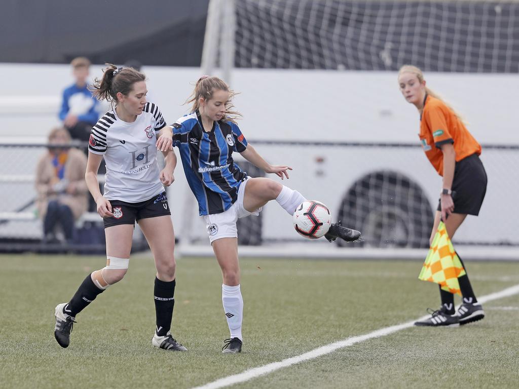 Hobart Zebras versus Kingborough Lions in the women's Statewide Cup final at KGV. Kingborough's Emille Tatton keeps the ball in play under pressure from Hobart's Rachel Gill. Picture: PATRICK GEE