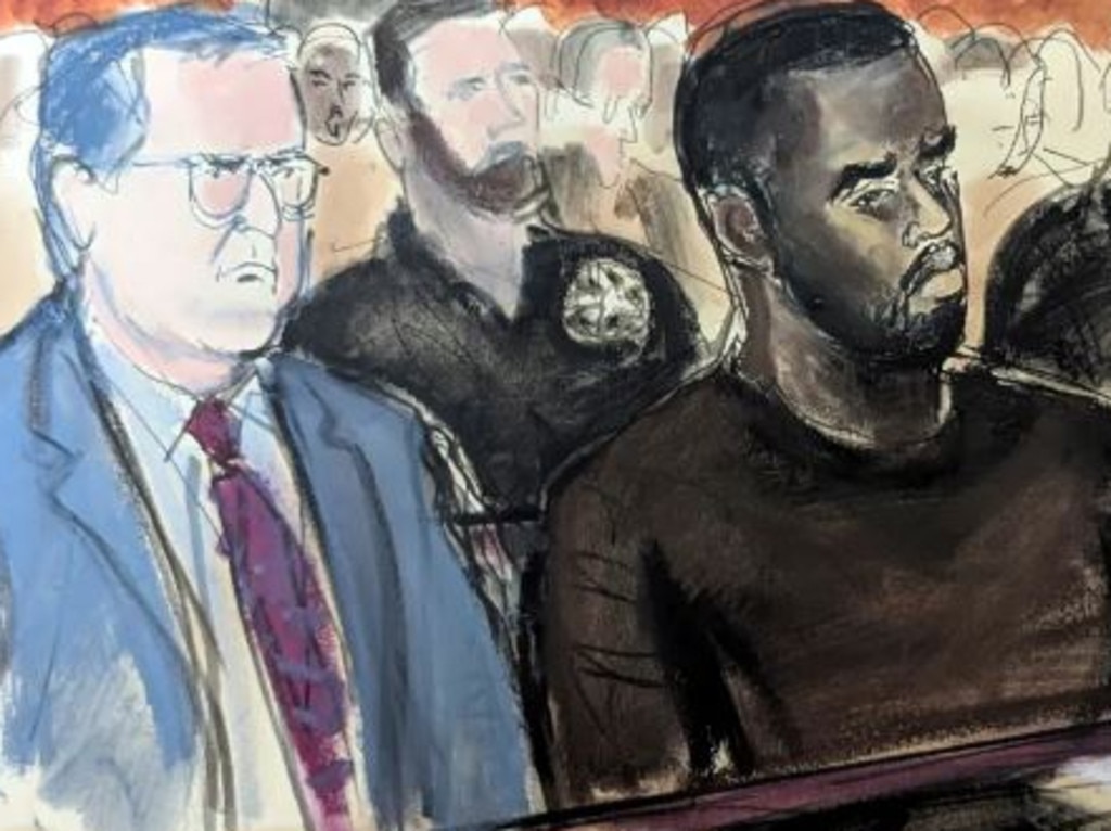 Diddy in court with his lawyer Marc Agnifilo.